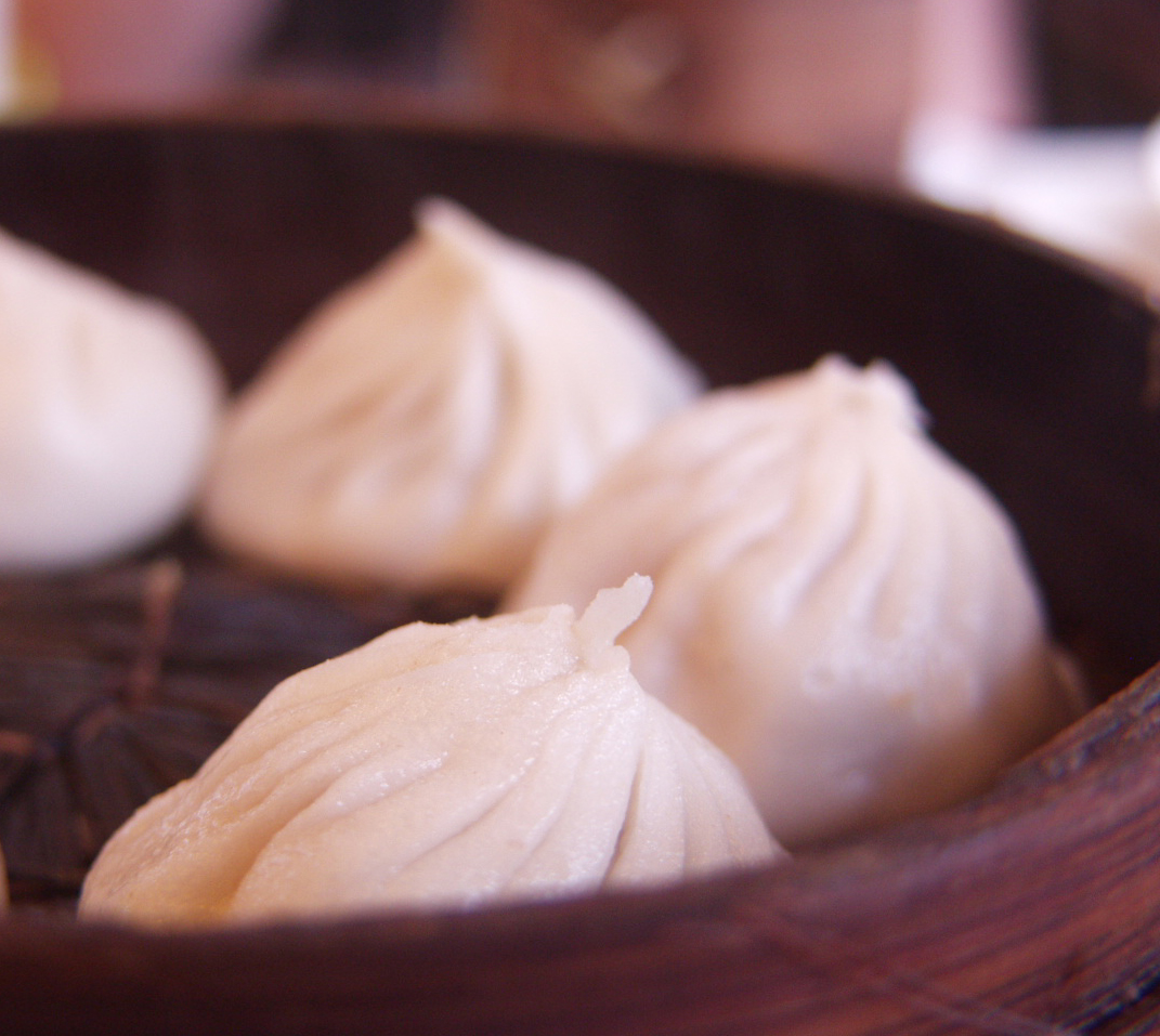 Soup dumplings in a bamboo steamer